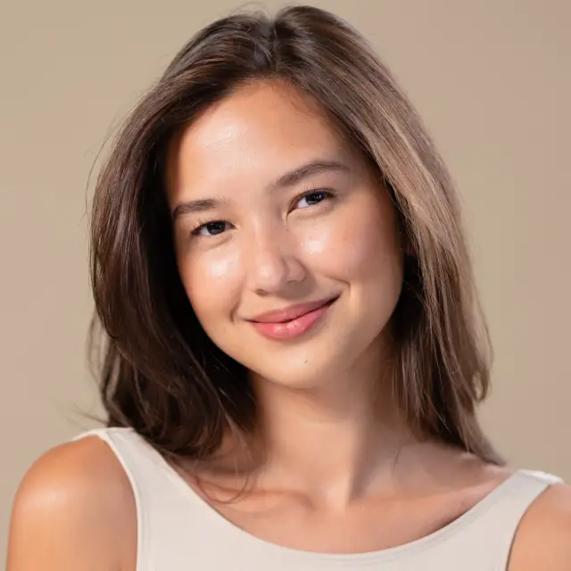Facial Plastic Surgeon Evaluating a Young Female Patients Face for Facelift