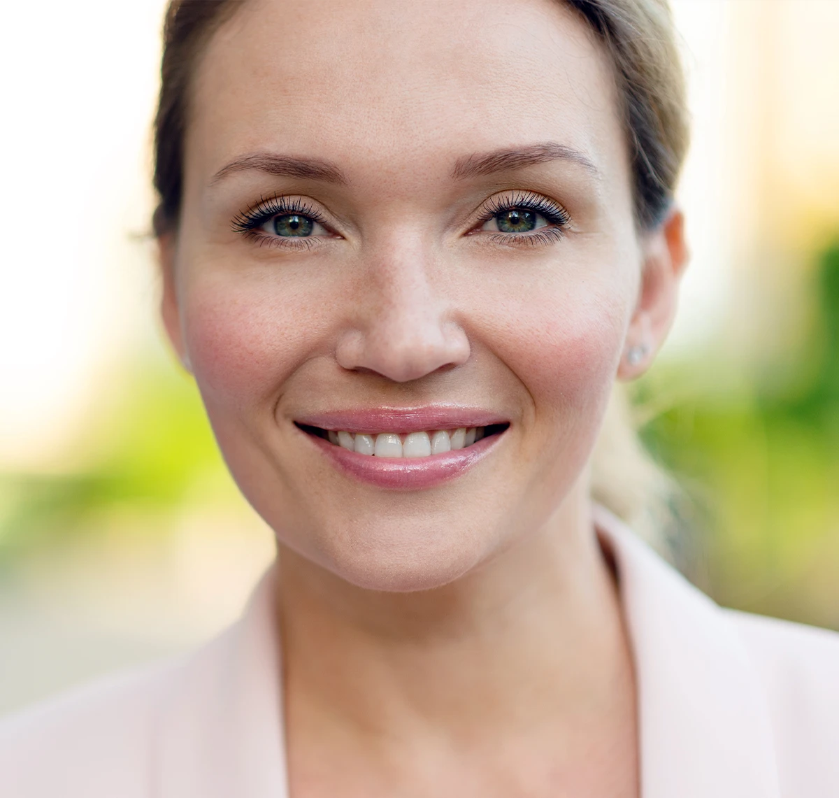 Smiling woman with smooth, youthful skin after RHA® Filler treatment in Columbus.