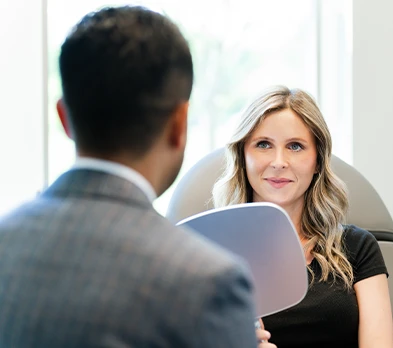  Am I a Good Candidate for Dysport in Columbus, OH?  Photo Patient reviewing facial appearance with provider during Dysport consultation in Columbus, Ohio aesthetic clinic